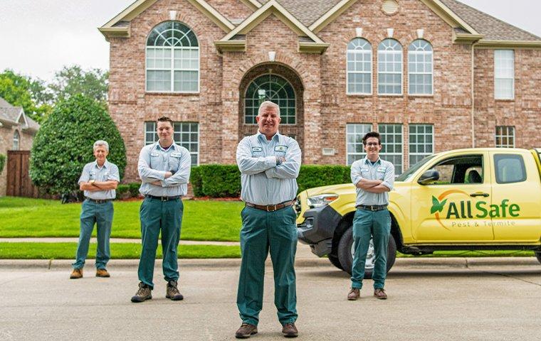 Residential pest control technicians and a truck